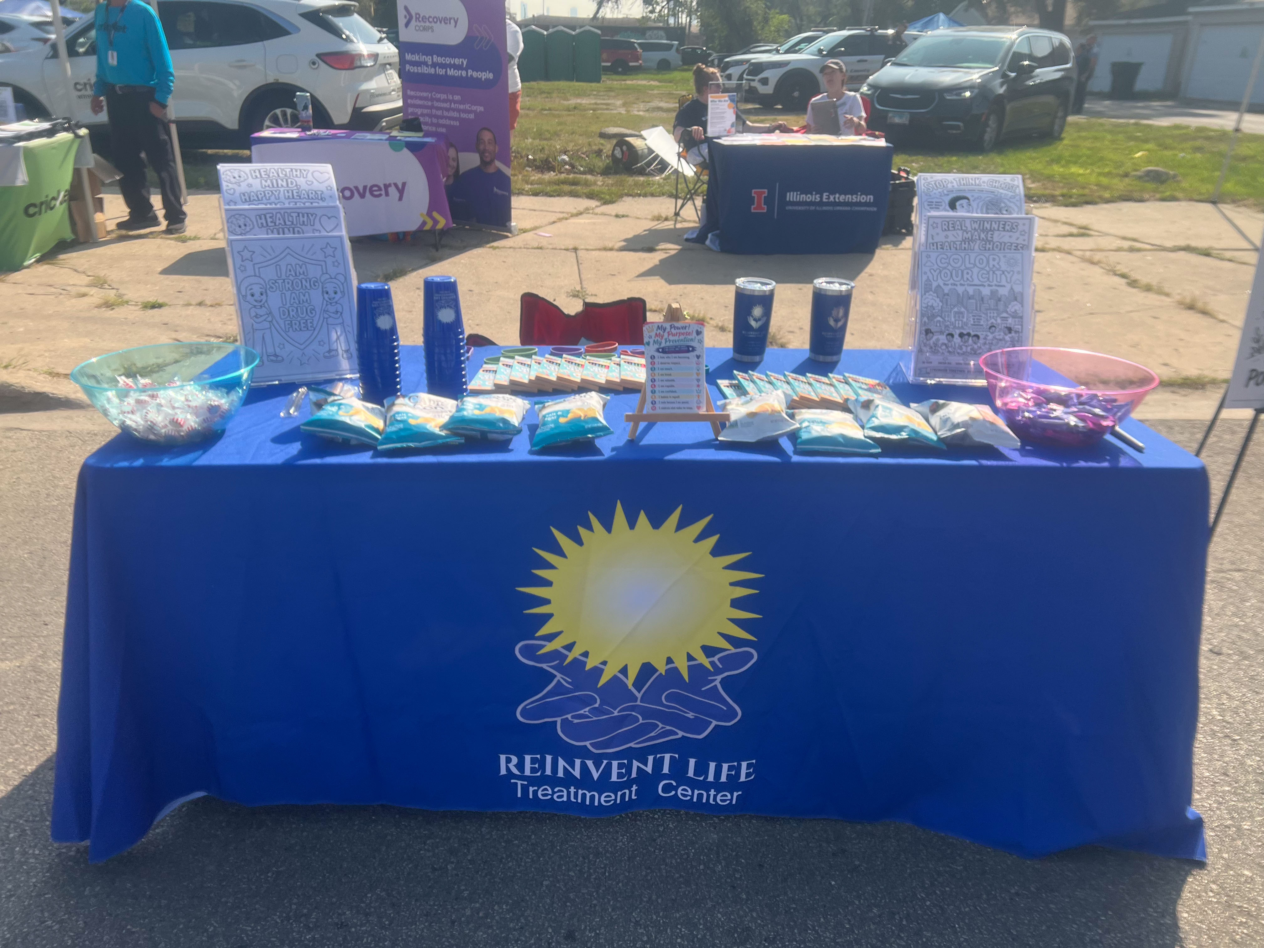 Reinvent Life booth alongside partner organizations at the fair