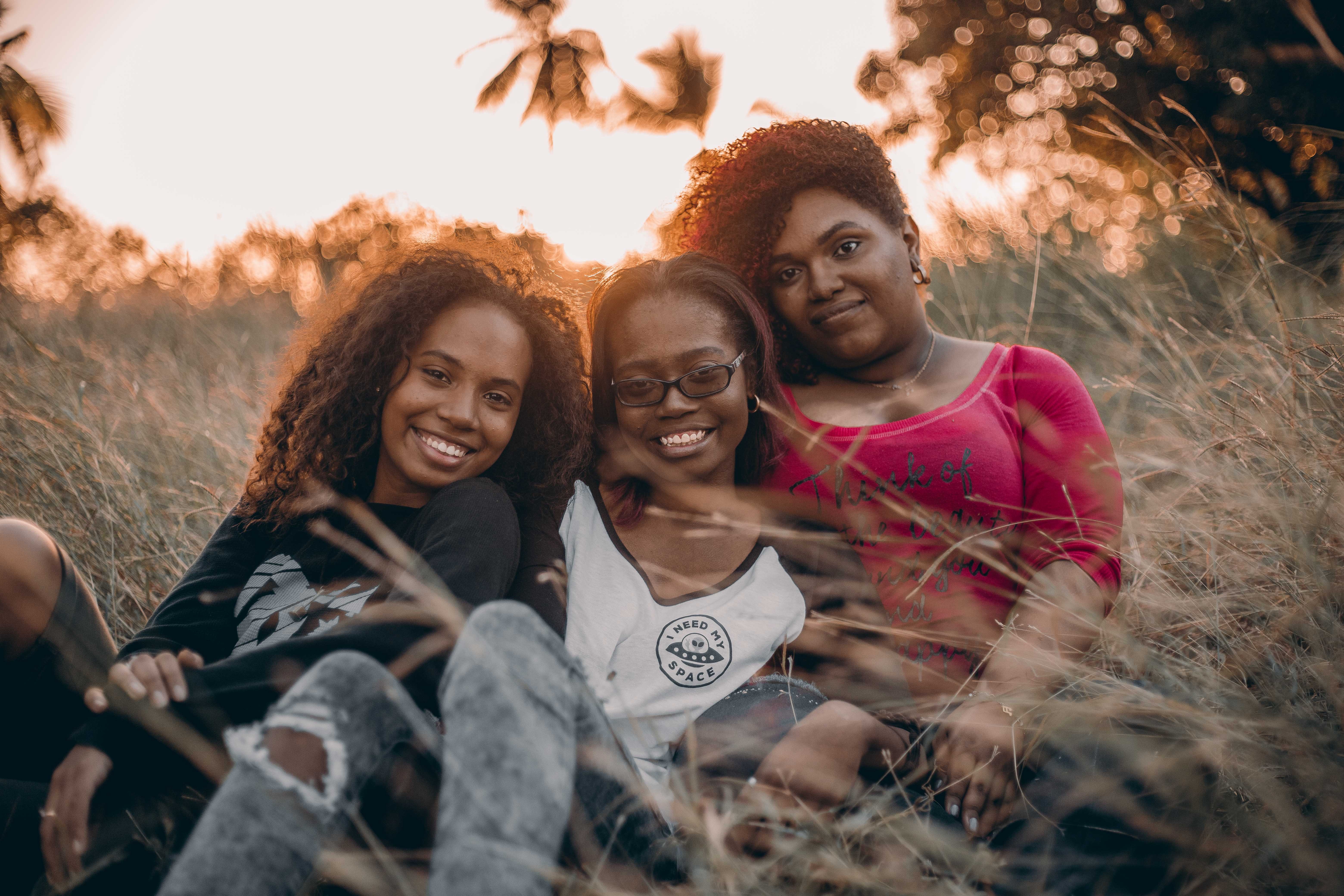 Three women supporting each other in recovery