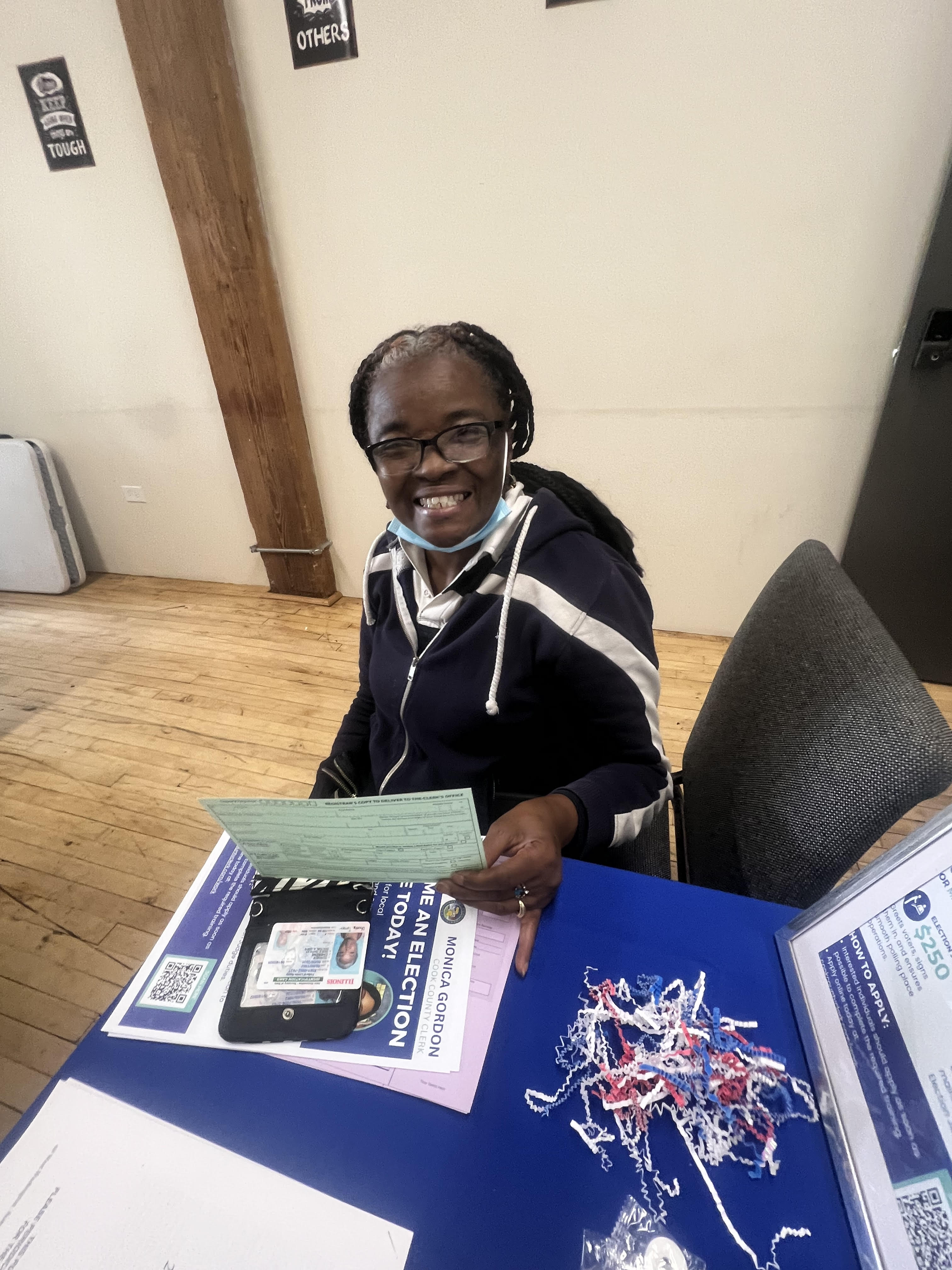 Community member filling out voter registration form